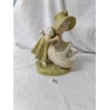 A Royal Dux figure of a girl with basket.