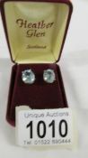 A pair of 9ct gold stud earrings set blue stones.