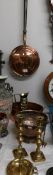 A mixed lot of brass and copper including warming pan, punch bowl, candlesticks. jug etc.