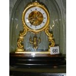 A good French alabaster mantel clock under dome with swinging cherub pendulum, complete and working.