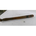 A Victorian truncheon, 44 cm long.