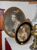 2 gilt framed oval portraits of Edwardian ladies.