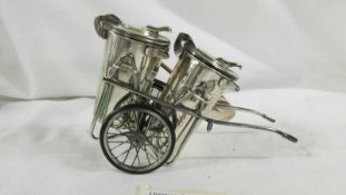 A Hall marked (925) silver novelty cruet in the form of a road sweeper dust cart, 4.