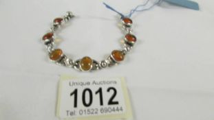 A silver bracelet set amber.