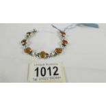 A silver bracelet set amber.