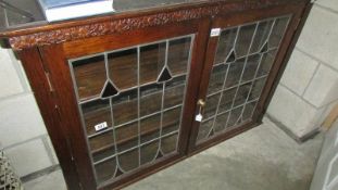 A lead glazed bookcase.