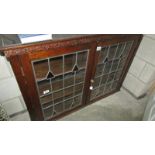 A lead glazed bookcase.