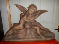 A Richard Aurili original statue of Psyche and Cupid in terracotta, signed.