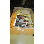A box containing a quantity of toy related reference catalogues and calendars.