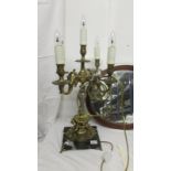 A fabulous gilt table lamp with 4 lights on a marble base (base has crack).