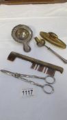 A continental silver tea strainer, a hall marked silver gilt nail buffer, a silver gilt comb a/f,