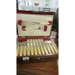 A good quality cased set of fish knives and forks with servers.