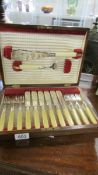 A good quality cased set of fish knives and forks with servers.