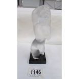 A frosted glass nude female figurine.