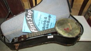 A cased 'Formby' ukelele/banjo.