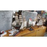 7 model sailing boats and 2 wall plaques.