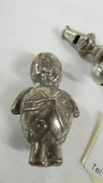 A silver 1906 babies rattle/teether and a silver plate rattle as a policeman. - Image 3 of 3