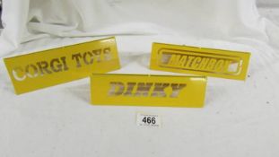 3 metal display signs - 'Dinky'. 'Corgi Toys' and 'Matchbox'.