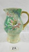 A Royal Doulton just under 22cm tall sturdy jug with yellowish ground and handle,