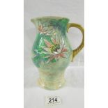 A Royal Doulton just under 22cm tall sturdy jug with yellowish ground and handle,