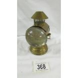A novelty Edwardian brass inkwell in the form of a coach lamp.