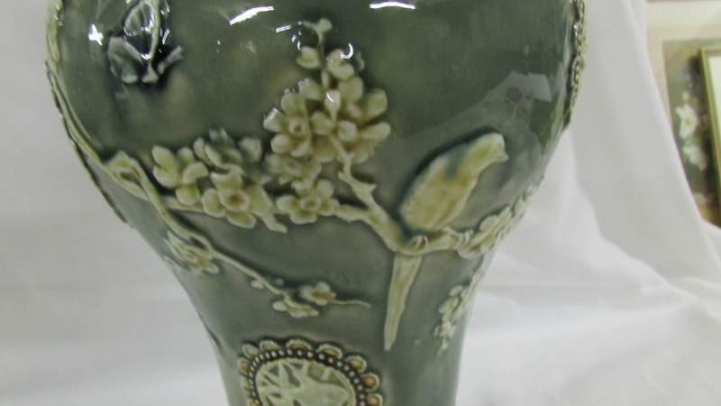 A Doulton Lambeth 26 cm vase decorated with birds, butterflies, - Image 4 of 5