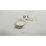 An 18ct yellow gold 3 stone diamond 35pt ring, size P.