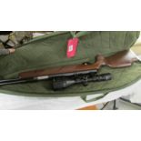 A Weimrauch HW97K 0.22 air rifle with sight and in case.