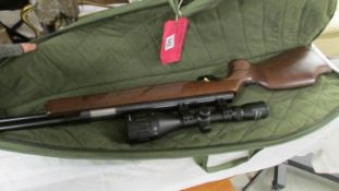 A Weimrauch HW97K 0.22 air rifle with sight and in case.