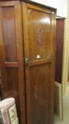 A 1930's single oak wardrobe.