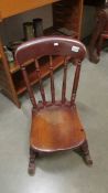 A Victorian rocking chair.