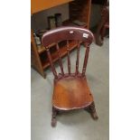 A Victorian rocking chair.