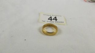 A 22 ct gold wedding ring, size M, 5.2 grams.