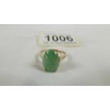 A 9ct gold ring set green stone, size N half.