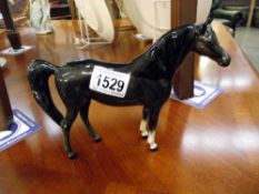 A Beswick horse. ****Condition report**** Undamaged. Height 16cm.