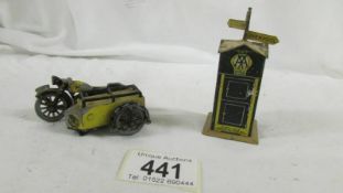 A pre war Dinky tin plate AA telephone box and a Benbros AA motorcycle a/f.