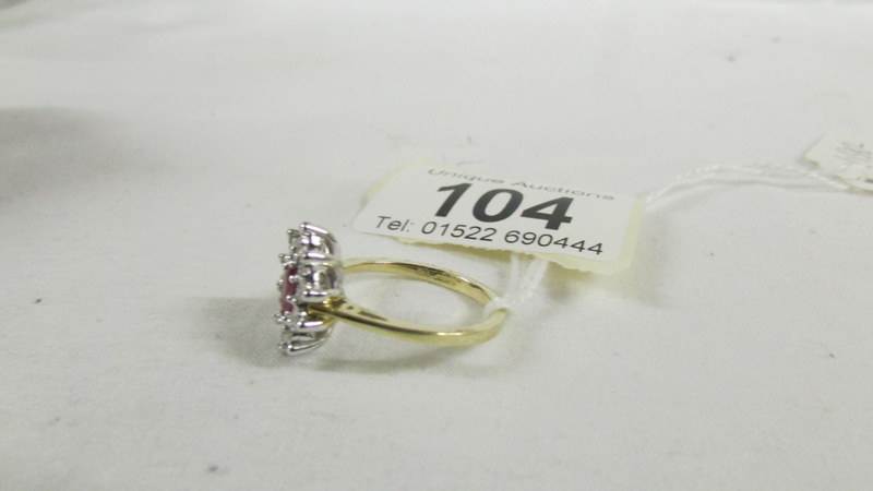 A yellow gold oval ruby and diamond ring, size O. - Image 2 of 2