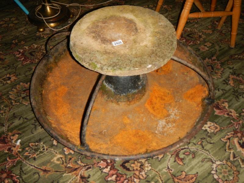 An old cast iron pig feeder.