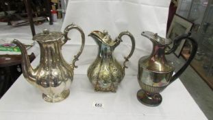 Three silver plate coffee pots.