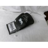 A signed boxing glove, John H Stracey.