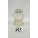 A glass owl in the style of Lalique.