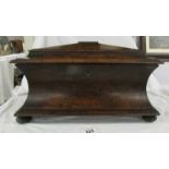 An impressive Georgian rosewood tea caddy with inset storage boxes on bun feet, 16" wide,