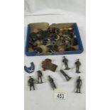 A mixed lot of die cast Dinky figures, rubber tyres etc.