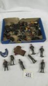 A mixed lot of die cast Dinky figures, rubber tyres etc.