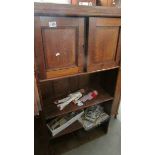 An oak cupboard/bookcase.