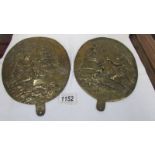 A pair of old oval brass plaques.