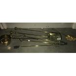 A set of brass fire irons, toasting fork etc.