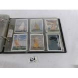 An album containing 9 sets of Player's, Will's cigarette cards.
