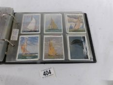 An album containing 9 sets of Player's, Will's cigarette cards.