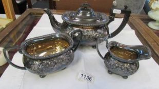 A three piece silver plate tea set.